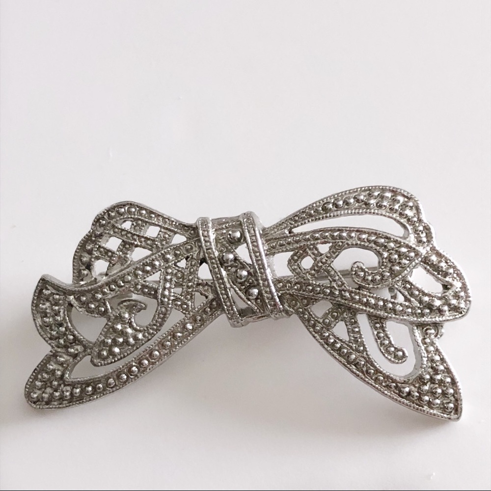 Silver tone bow brooch
